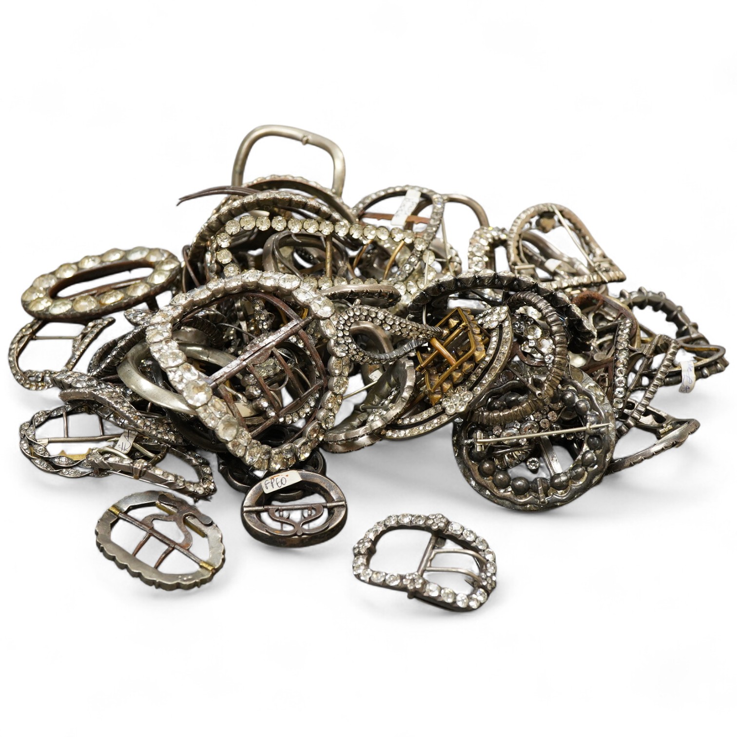 A large collection of buckles, 18th-19th century, of oval and rectangular outline, set with pastes mostly mounted in steel, a minority in silver, some with later brooch fittings